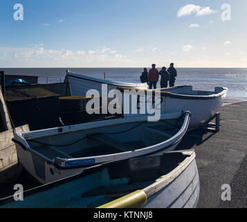 Sidmouth, Devon. 27th Dec, 2017. UK Weather. Lots of people braved temperatures barely above freezing to enjoy a walk on the front at Sidmouth, Devon. Credit: Photo Central/Alamy Live News Stock Photo