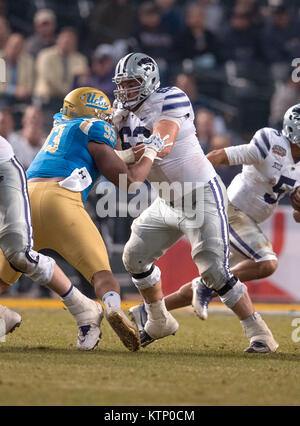 Phoenix, AZ, USA. 26th Dec, 2017. Kansas State offensive lineman (62) Tyler Mitchell blocks UCLA defensive lineman (93) Chigozie Nnoruka during the Cactus Bowl game between Kansas State Wildcats vs the UCLA Bruins on Tuesday, December 26, 2017 in Phoenix, AZ. Kansas State defeated UCLA 35-17. (Mandatory Credit: Juan Lainez/MarinMedia.org/Cal Sport Media) (Complete photographer, and credit required) Credit: csm/Alamy Live News Stock Photo