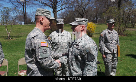 Joseph Mitchell is promoted to the rank of Command Sgt. Maj. by Maj. Gen. Patrick A. Murphy, the Adjutant General of the State of New York, during a change of responsibilities ceremony for the Recruiting and Retention Battalion of the New York Army National Guard held at the Watervliet Arsenal April 28th, 2014. (US Army photo by Sgt. Jeremy Bratt) Stock Photo