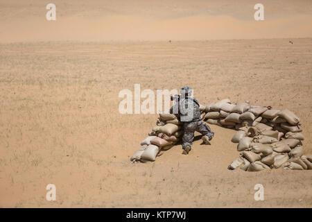 Soldiers from the 642nd Aviation Support Battalion (ASB), 42nd Combat Aviation Brigade, conduct a live fire of the AT-4 anti-tank weapon on May 19th, 2014, near Camp Buehring, Kuwait.  The 642nd ASB, New York Army National Guard, is currently deployed to Kuwait in support of Operation Enduring Freedom.  Over the deployment the battalion has been able to train its soldiers on each assigned weapon system, including the MK-19 grenade launcher and M2 .50 caliber machine gun. (N.Y. Army National Guard photo by Sgt. Harley Jelis/Released) Stock Photo