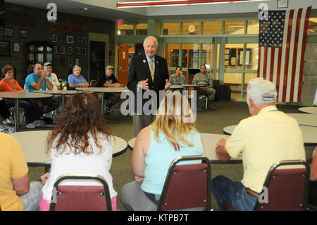 Senator William J. Larkin Jr., NY 39th congressional district, speaks to Korean conflict veterans of the 1503 Air Transportation Wing, and their family members during a tour of the New York Air National Guard's 105th Airlift Wing at Stewart Air National Guard Base in Newburgh, Sept. 4, 2014. (U.S. Air National Guard photo by Tech. Sgt. Michael OHalloran/Released) Stock Photo