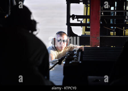 GULFPORT COMBAT READINESS TRAINING CENTER, MS - Aircrew members of the 102nd Rescue Squadron conduct combat offload training at Shelby, Mississippi Mississippi on November 4th, 2014. Combat offloading allows aircrew to drop large pallets while still on the ground without having to remove any personnel from the aircraft.  Exercise Southern Strike 15 (SS15) is a total force, multiservice exercise hosted by the Mississippi National Guard's CRTC. SS15 emphasises air-to-air, air-to-ground and special operations forces training opportunities. These events are integrated into demanding hostile and as Stock Photo