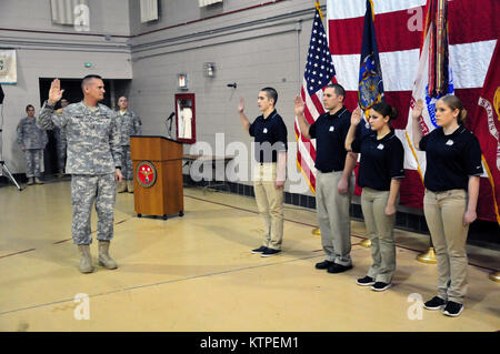 LATHAM -- New York Army National Guard Maj. Gen. Patrick Murphy, the adjutant general of New York, conducts an oath reaffirmation ceremony with five New York Army National Guard and five New York Air National Guard recruits during a 378th National Guard birthday celebration held Monday, Dec. 15 at New York State Division of Military and Naval Affairs headquarters in Latham, N.Y. The 10 new members have not yet attended their initial training school and cannot yet wear the uniform. The oath reaffirmation ceremony was coupled with a traditional cake-cutting event. The new recruits family members Stock Photo