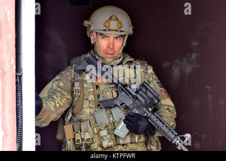 FORT DRUM, NY- Capt. Paul Spendley, a Tactical Air Control Party (TACP) Airman, exits his teams observation rally point (ORP) during a training exercise at Fort Drum, NY on March 14, 2015. 30 Airmen from the New York Air National Guard’s 274th Air Support Operations Squadron (ASOS) participated in Close Air Support (CAS) training that enhances their ability to identify a target and neutralize a threat. The 274th mission is to advise US Army commanders on how to best utilize US and NATO assets for Close Air Support. (New York Air National Guard photo by Master Sgt. Eric Miller/Released) 150314- Stock Photo