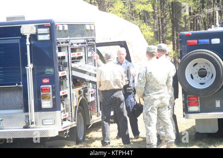 U.S. Army 1st Lt. Chris Giebel from the New York National Guard’s 2nd Civil Support Team (Weapons of Mass Destruction) gives an overview of capabilities and equipment for members of the New Jersey Task Force One Urban Search and Rescue Team along with other representatives of the New Jersey Office of Emergency Management at Joint Base Maguire-Dix-Lakehurst April 16. The CST is participating in a full-scale exercise of the FEMA Region II Homeland Response Force April 15-19, bringing together some 800 New York and New Jersey National Guard members for disaster response training. U.S. Army Nation Stock Photo