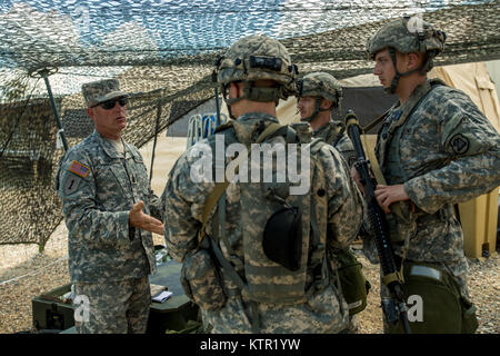 Command Sgt. Maj. William Thayer, left, senior enlisted advisor with the 109th Medical Battalion, Iowa Army National Guard, speaks to Soldiers of the 209th Area Support Medical Company during the unit's Joint Readiness Training Center (JRTC) rotation July 19, 2016, in Fort Polk, La.  The Iowa medical personnel joined more than 5,000 Soldiers from other state Army National Guard units, active Army and Army Reserve troops as part of the 27th Infantry Brigade Combat Team task force.  The Soldiers will hone their skills and practice integrating combat operations ranging from infantry troops engagi Stock Photo