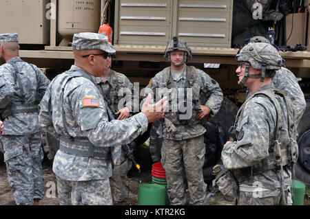 Ohio Army National Guard Maj. Gen. John Harris, Jr., Assistant Adjutant General visits his Soldiers to discuss training at the Army’s Joint Readiness Training Center, Fort Polk, Louisiana, July 27, 2016. Approximately 3,000 Soldiers from New York joined 2,000 other state Army National Guard units, active Army and Army Reserve troops as part of the 27th Infantry Brigade Combat Team’s Task Force Hunter.  The Soldiers are honing their skills and practicing integrating combat operations ranging from infantry troops engaging in close combat with an enemy and employing artillery and aviation, July 9 Stock Photo