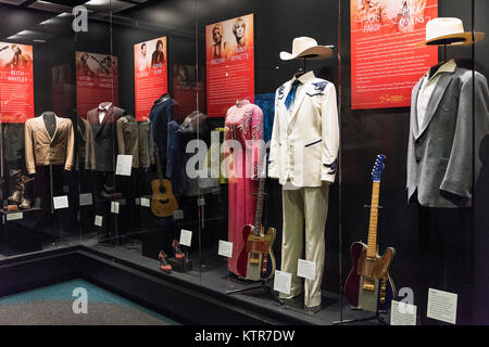 Exhibit of stage clothing from various country music stars, Country Music Hall of Fame, Nashville, Tennessee, USA. Stock Photo