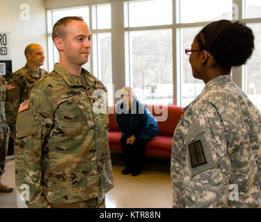 Staff Sgt. Michael Davis, 138th Public Affairs Detachment, is promoted at Camp Smith, N.Y., Dec. 4, 2016. (U.S. Army National Guard photo by Sgt. Harley Jelis) Stock Photo