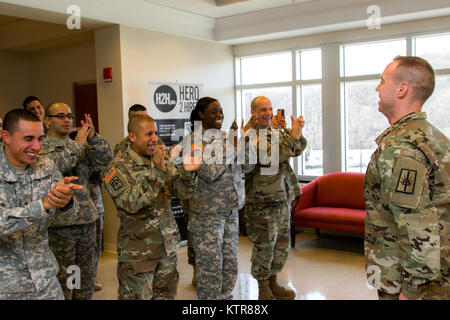 Staff Sgt. Michael Davis, 138th Public Affairs Detachment, is promoted at Camp Smith, N.Y., Dec. 4, 2016. (U.S. Army National Guard photo by Sgt. Harley Jelis) Stock Photo