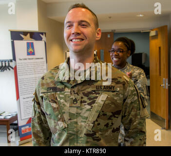 Staff Sgt. Michael Davis, 138th Public Affairs Detachment, is promoted at Camp Smith, N.Y., Dec. 4, 2016. (U.S. Army National Guard photo by Sgt. Harley Jelis) Stock Photo