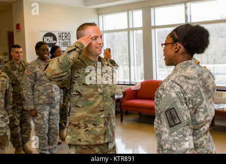 Staff Sgt. Michael Davis, 138th Public Affairs Detachment, is promoted at Camp Smith, N.Y., Dec. 4, 2016. (U.S. Army National Guard photo by Sgt. Harley Jelis) Stock Photo