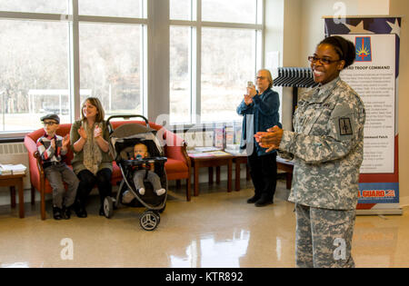 Staff Sgt. Michael Davis, 138th Public Affairs Detachment, is promoted at Camp Smith, N.Y., Dec. 4, 2016. (U.S. Army National Guard photo by Sgt. Harley Jelis) Stock Photo