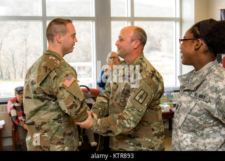 Staff Sgt. Michael Davis, 138th Public Affairs Detachment, is promoted at Camp Smith, N.Y., Dec. 4, 2016. (U.S. Army National Guard photo by Sgt. Harley Jelis) Stock Photo