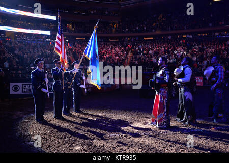 Members of the Joint Base McGuire - Dix - Lakehurst Air Force Honor Guard presents the colors the Professional Bull Rider's Association Rodeo at Madison Square Garden in New York City on January 6, 2017.  The mission of the JB MDL Air Force Honor Guard is to represent the Air Force during military funeral honors and ceremonial functions. The primary mission of The Honor Guard is performing funeral honors for past and present members of the United States Air Force and veterans of the Army Air Forces and Army Air Corps. The Honor Guard’s area of responsibility includes portions of New Jersey, Ne Stock Photo