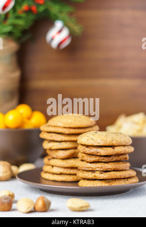 freshly baked chocolate chip cookies on a table with blurred background Stock Photo