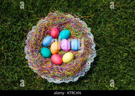 Colourful Easter eggs in a basket, New Jersey, USa, NJ images spring wreath concept Stock Photo