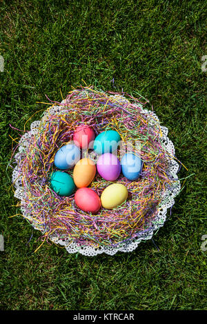 Colorful hard boiled dyed Easter eggs in a nest, New Jersey, USA Easter bonnet concept Stock Photo