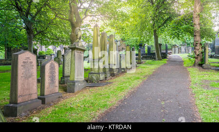 Cemetery near Parish Church of St Cuthbert in the Princes Street Gardens in a sunny summer afternoon. Edinburgh, Scotland Stock Photo