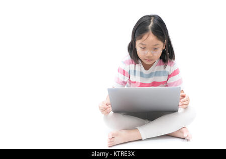 asian cute girl student using laptop to do homework isolated on white background, education concept Stock Photo