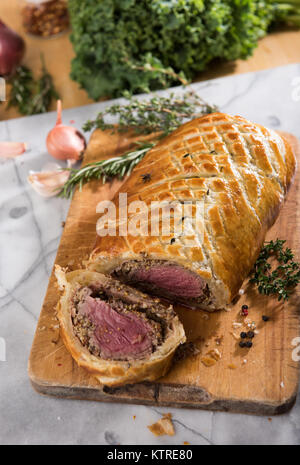 Fresh Homemade Beef Wellington in Flaky Puff Pastry Dough Stock Photo