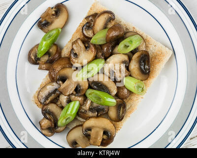 Fried Mushrooms and Spring Onions on Toast Stock Photo