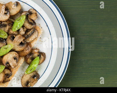 Fried Mushrooms and Spring Onions on Toast Stock Photo