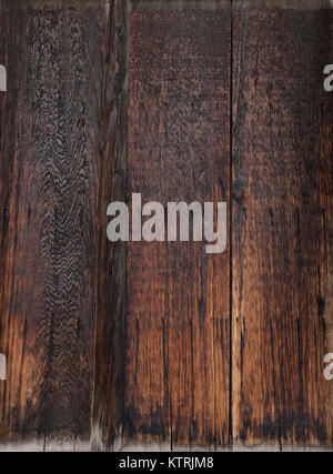 Closeup of charred dark brown wooden boards, abstract texture background. Stock Photo