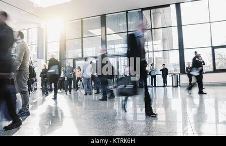 blurred Exhibition visitors in motion Stock Photo