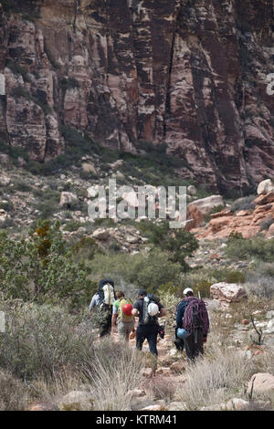 Tourists hike through the Red Rock Canyon National Conservation Area March 6, 2010 near Las Vegas, Nevada. Stock Photo