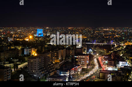 Traffic jam in Amman city at night - Abdoun bridge and Amman mountains at night Stock Photo