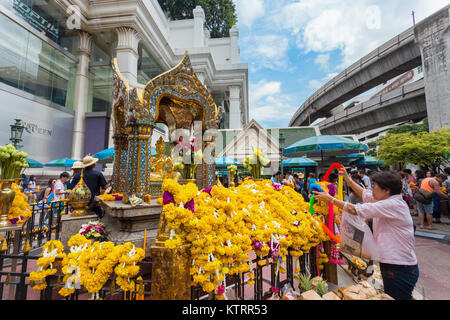 The Erawan Shrine in Bangkok  BANGKOK, THAILAND - AUGUST 11: The Erawan Shrine in Bangkok, Thailand on August 11, 2014. Houses a statue of Phra Phrom  Stock Photo