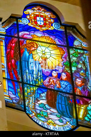 Three Peasant Children Angel Stained Glass Basilica of Lady of Rosary Fatima Portugal. Church created on site where three Portuguese Shepherd children Stock Photo