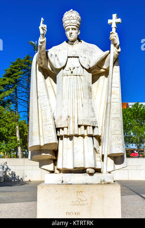 Pope Pius XII Statue Basilica of Lady of Rosary Fatima Portugal. Church created on site where three Portuguese Shepherd children saw Virgin Mary of th Stock Photo