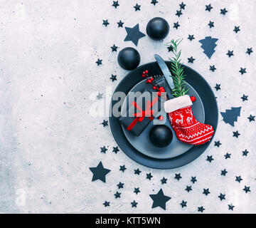 Festive Christmas place setting and decorations Stock Photo