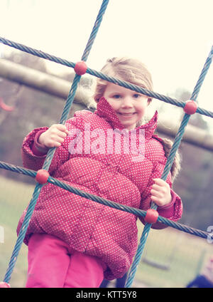 Smiling girl climbing on rope acrobatic gymnastic girl exercising on fabric  rope Stock Photo - Alamy