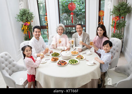 Happy family having Chinese New Year dinner Stock Photo