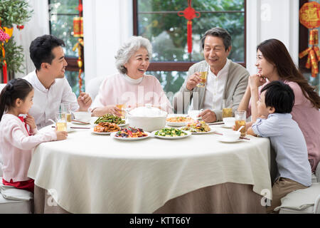 Happy family having Chinese New Year dinner Stock Photo