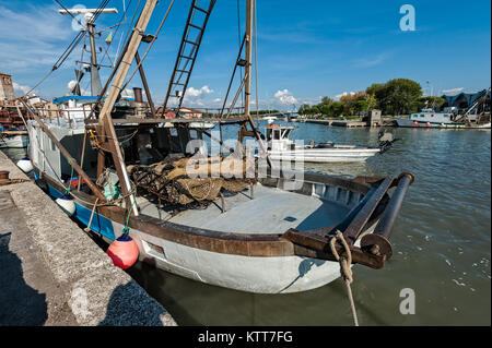 Commercial fishing boats moored in harbor. Stock Photo