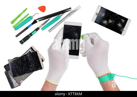 Repair of the  modern smart phones in the professional european service center. Repair man uses the ESD antistatic gloves and wristband. Isolated on w Stock Photo