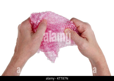 The best cure for stress is to burst the bubbles of the packing bag with your own hands. Isolated on white studio concept Stock Photo
