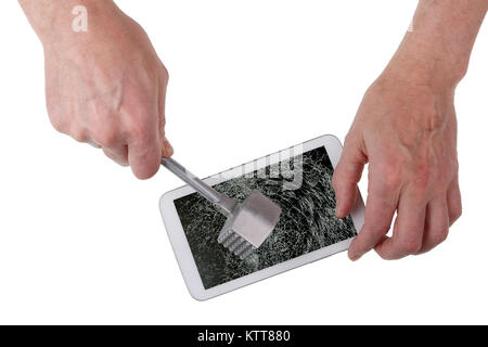 Angry old man with a kitchen iron hammer smashes destroys a  tablet display. Isolated on white concept studio shot. Tablet screen with clipping patch Stock Photo