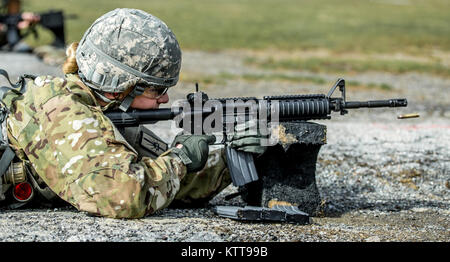 U.S. Army Spc. Courtney Natal zeroes her weapon before shooting a weapon qualification during the New York Army National Guard Best Warrior Competition at Camp Smith Training Site March 30, 2017. The Best Warrior competitors represent each of New York's brigades after winning competitions at the company, battalion, and brigade levels. At the state level they are tested on their physical fitness, military knowledge, endurance, marksmanship, and land navigation skills. The two winners of the competition, one junior enlisted and one NCO, advance to compete at the regional level later this year. ( Stock Photo
