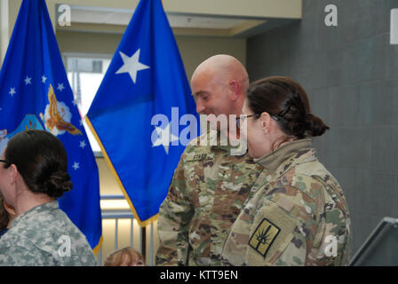 Chief Warrant Officer 2 Matthew Starr  is congratulated following his promotion ceremony on March 31, 2017 at New York National Guard headquarters in Latham, N.Y. Starr works in the New York National Guard federal personnel office. ( U.S. Army National Guard photo by Eric Durr) Stock Photo