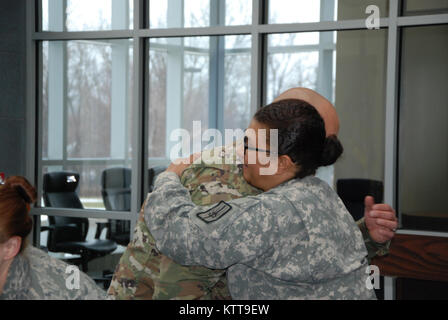 Chief Warrant Officer 2 Matthew Starr  is congratulated following his promotion ceremony on March 31, 2017 at New York National Guard headquarters in Latham, N.Y. Starr works in the New York National Guard federal personnel office. ( U.S. Army National Guard photo by Eric Durr) Stock Photo