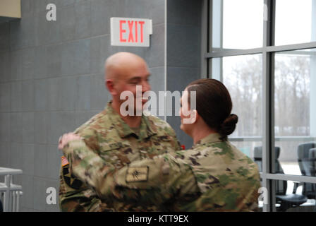 Chief Warrant Officer 2 Matthew Starr  is congratulated following his promotion ceremony on March 31, 2017 at New York National Guard headquarters in Latham, N.Y. Starr works in the New York National Guard federal personnel office. ( U.S. Army National Guard photo by Eric Durr) Stock Photo