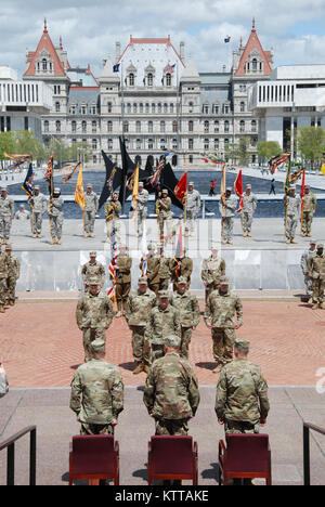 Soldiers of the New York Army National Guard’s 42nd Infantry Division conduct a division change of command ceremony at the Empire State Plaza in Albany on May 6, 2017. Brig. Gen. Steven Ferrari assumed command of the division headquarters from Maj. Gen. Harry Miller in front of the colors and Soldiers of the 42nd Division's associated brigades. U.S. Army National Guard photo by Col. Richard Goldenberg. Stock Photo