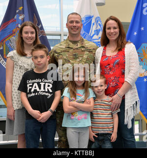 Newly-promoted Master Sgt. Michael J. Blass (center) poses with his wife and children after his promotion ceremony at the New York State Division of Military and Naval Affairs in Latham, N.Y. on May 31, 2017. Blass is the senior Army assistant inspector general for the New York National Guard. His family members are: wife Laura Blass (top right); daughter Anna Blass (top left); son Samuel (bottom left); daughter Elisia (bottom center); and son Joshua (bottom right). Blass and his family live in Maplecrest, N.Y. (U.S. Army National Guard photo by Master Sgt. Raymond Drumsta, 42nd Infantry Divis Stock Photo