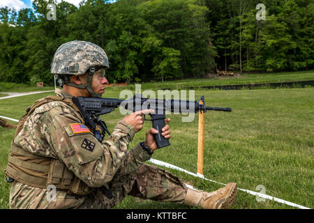 U.S. Army Staff Sgt. Raphael Ramos, a Soldier with the 152nd Engineer Support Company, New York Army National Guard, loads his M4 carbine during the SGT Henry Johnson Individual Combat Rifle Match as part of the 38th Annual &quot;TAG (The Adjutant General) Match&quot; Combat Sustainment Training Exercise at Camp Smith Training Site, N.Y., June 3, 2017. The TAG Match is a 3-day event conducted by the New York Army National Guard to promote excellence in marksmanship training and offer Soldiers, Airmen and State Militia the opportunity to test their skills and weapon systems in a battle-focused  Stock Photo