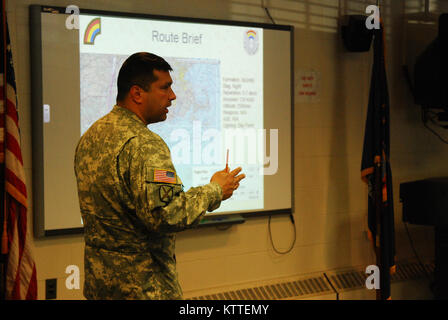 N.Y. Army National Guard Soldiers assigned to 3rd Battalion, 142nd Aviation receive a briefing on their upcoming mission in Latham, N.Y., Sept 10, 2017. The 3rd Battalion, 142nd Aviation was preparing to deploy to Florida to bring aid to the victims of Hurricane Irma. (U.S. Army National Guard photo by Pfc. Andrew Valenza) Stock Photo